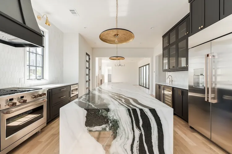 Custom marble waterfall island fabricated by TNT Countertops